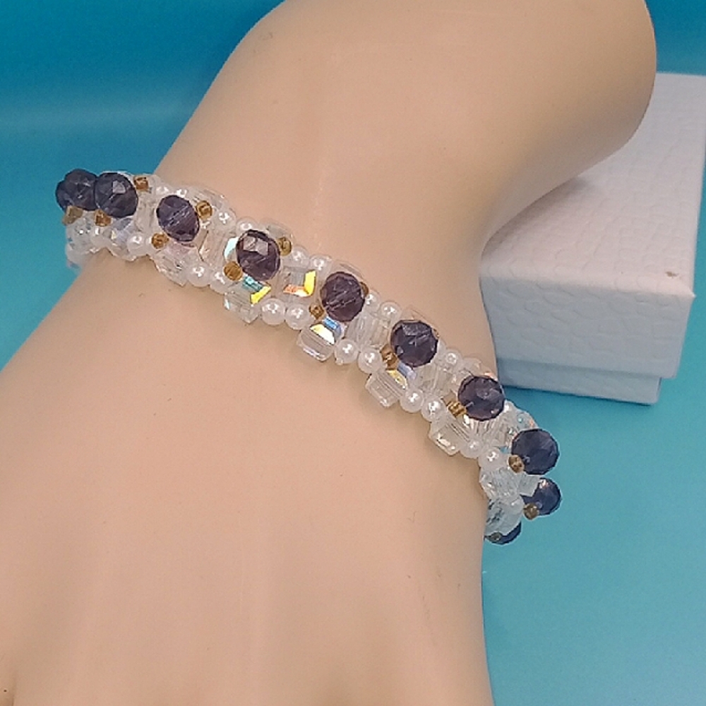 Elegant beaded bracelet with white and purple accents